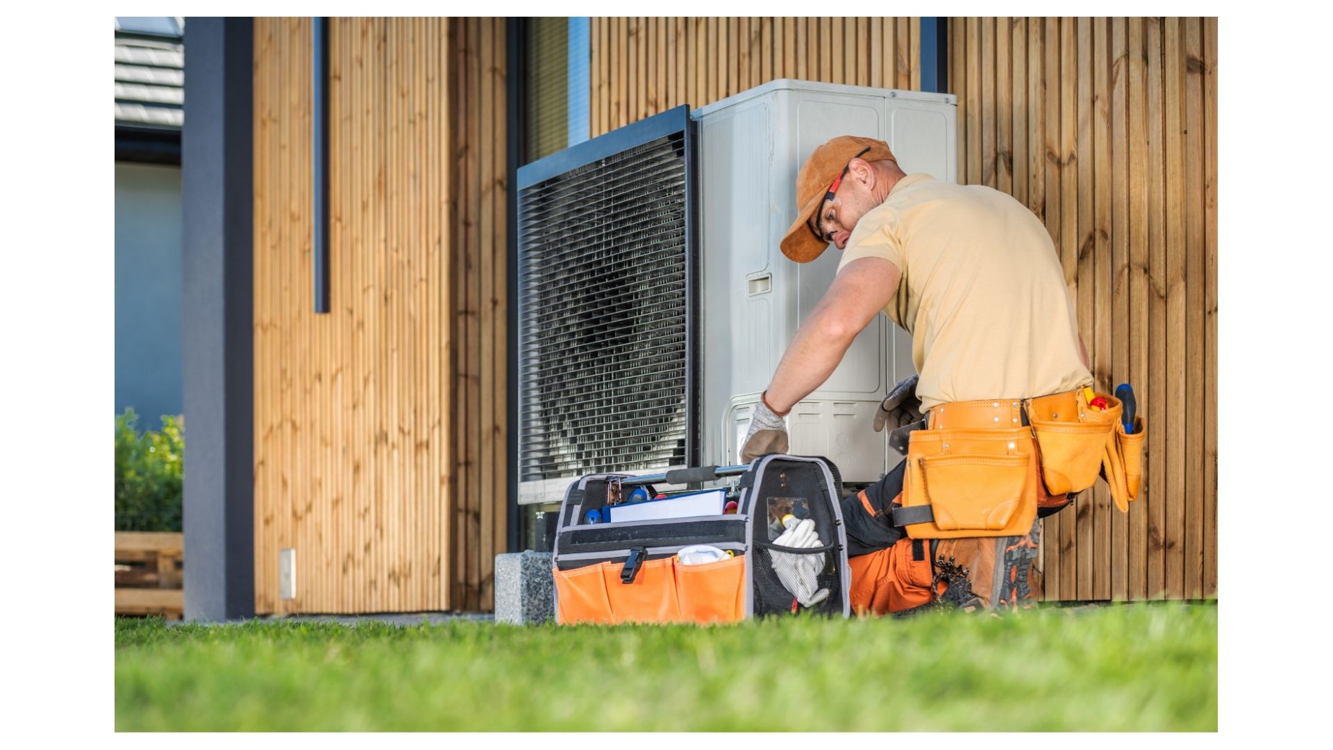 end of summer HVAC Branson MO - Now! Heating & Cooling technician inspecting outdoor unit before fall