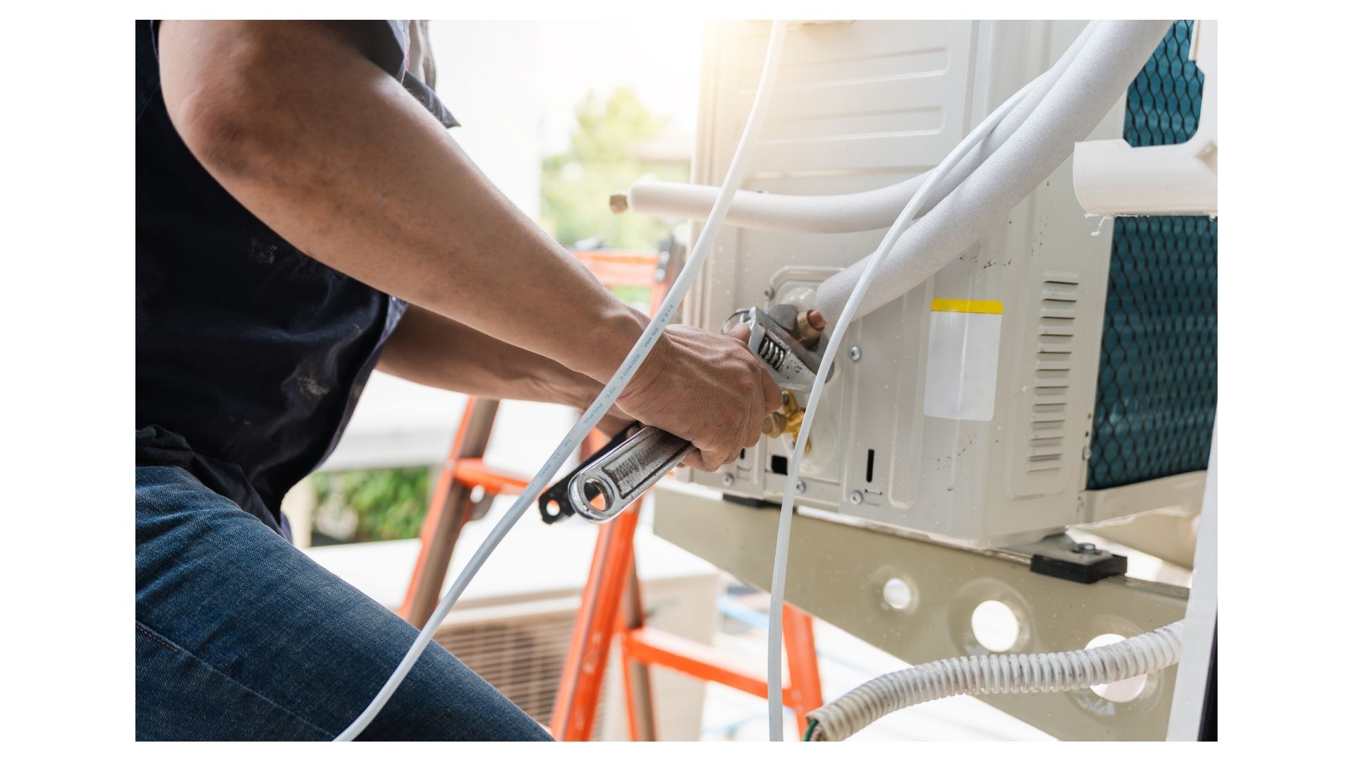 AC repair Branson MO - Now! Heating & Cooling technician checking refrigerant levels on home AC unit